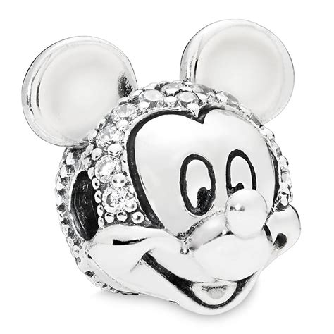 Hand-finished in sterling silver, this style includes a heart-shaped clasp with Mickey Mouses silhouette on the front decorated with clear stones. . Pandora charm mickey mouse